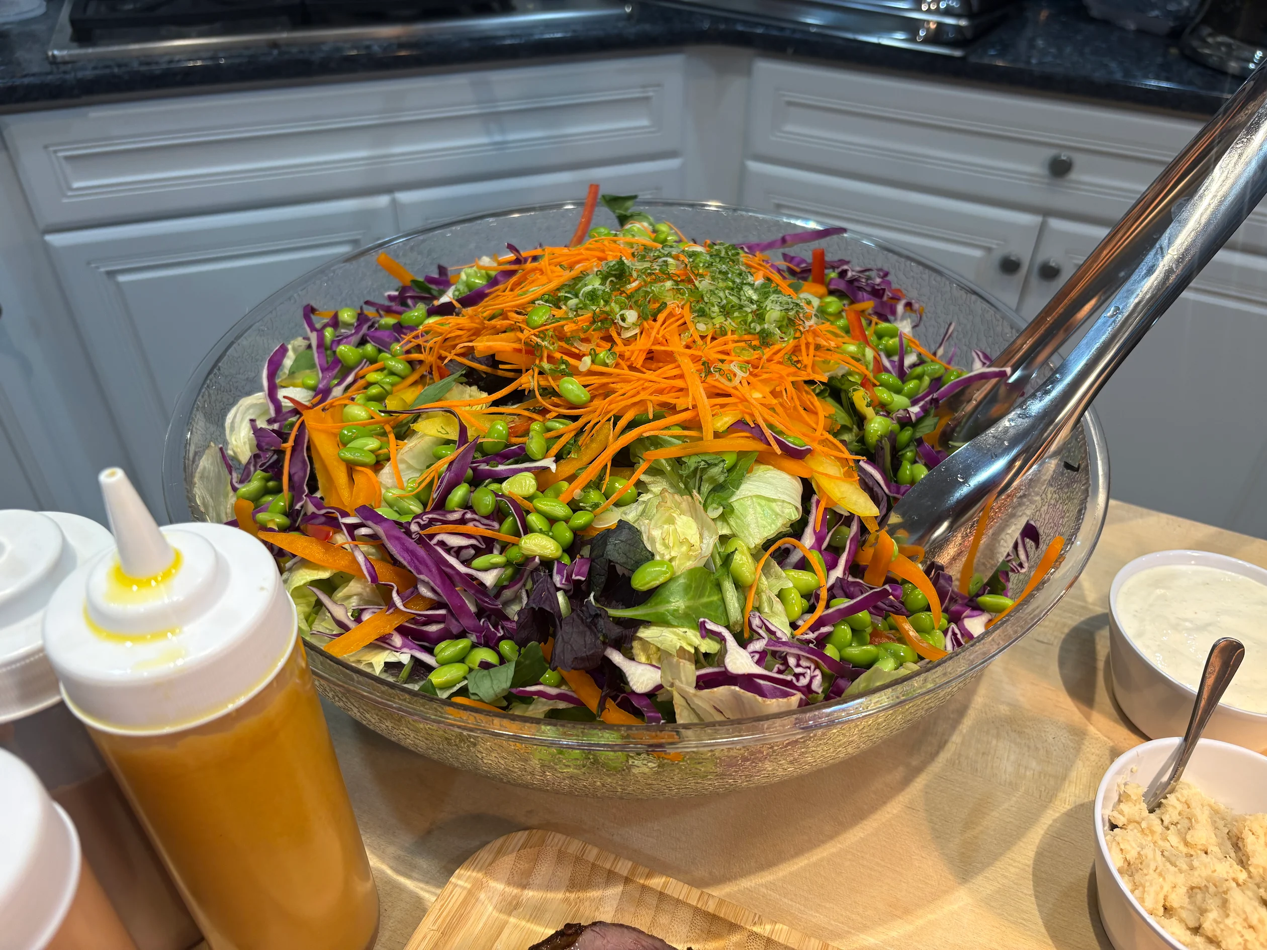 Fresh chopped salad with red cabbage, carrots and edamame served at a private event
