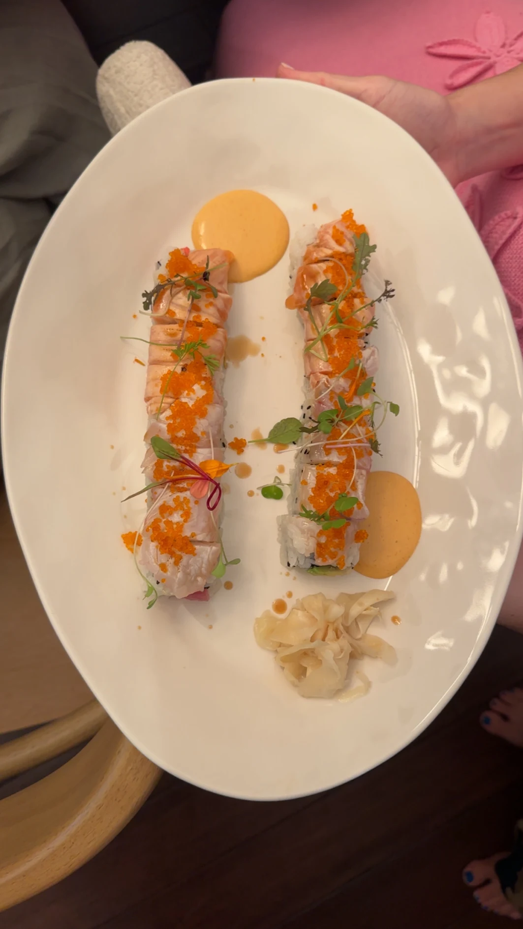 Chef-plated torched salmon rolls with tobiko and microgreens from an at-home sushi experience in Virginia Beach
